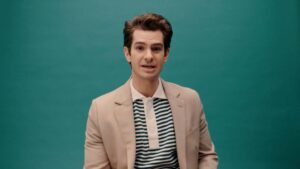 Thumbnail for a video featuring actor Andrew Garfield modeling fashionable clothes and sharing random facts with the viewer.